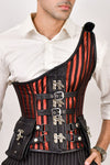 Red brocade corset with shoulder strap, featuring intricate patterns for a fashionable and structured silhouette